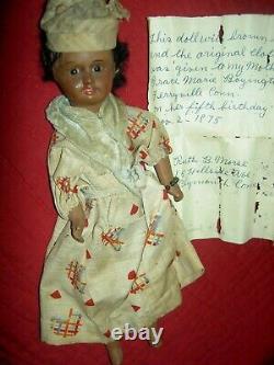 Pretty antique, BROWN bisque, signed UNIS 60 FRANCE, jointed doll withglass eyes